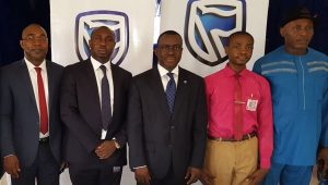L-R: Head, Commercial Suites, South-East, Stanbic IBTC Bank, Mr. Hillary Nwodo; Regional Manager, South-East; Stanbic IBTC Bank, Mr. Victor  Ekeocha; Chief Executive, Stanbic IBTC Bank, Dr. Demola Sogunle; School Captain, Government College Umuahia, Master Emeku Iheanyi; and The Principal, Government College Umuahia, High-Chief Jerry Onyemachi, during the Financial Literacy Day in celebration in Umuahia on Thursday 30th March, 2017.  