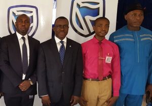 L-R: Regional Manager, South-East; Stanbic IBTC Bank, Mr. Victor  Ekeocha; Chief Executive, Stanbic IBTC Bank, Dr. Demola Sogunle; School Captain, Government College Umuahia, Master Emeku Iheanyi; and The Principal, Government College Umuahia, High-Chief Jerry Onyemachi, during the Financial Literacy Day in celebration in Umuahia on Thursday 30th March, 2017.