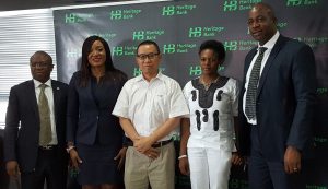 L-R Mr. Jude Monye, Executive Director Business Banking; Mrs. Adaeze Udensi, Executive Director; Retail & SME Bank; who both represented the MD/CEO of Heritage Bank Plc, Mr. Ifie Sekibo; the General Manager, Biase Plantations Limited (BPL), Mr. Ahmad Mustaffa Goh, Out-grower Officer BPL, Miss Solange Wankwi and Corporate Affairs Manager, Mr. Antigha Essien Esiet, at the signing ceremony of N232million Pilot Out-growers’ Agreement between the Bank and Biase Plantations Limited at Heritage Bank’s Head Office, Lagos. 