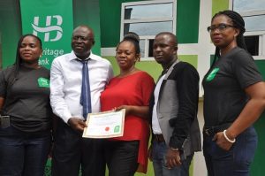L-R:  Zonal Head, South-West, Agent Banking, Heritage Bank, Oluwakemi Adewunmi; Managing Director, Dunmop Ventures/Agent, Mr Ayo Kale, his wife, Mrs OluwaKemi Kale; Managing Director, OC Ventures, Mr Hassan Azeez Olasukanmi, and Experience Centre Manager, Idumagbo, Nneoma Orji, during the inauguration of Heritage Bank in Lagos …yesterday