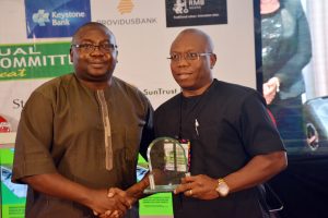 L-R: CBN Deputy Governor Operations, Mr. Adebayo Adelabu presenting award "For Sustainable Transaction of The Year in Agriculture" to the MD/CEO of Heritage Bank, Mr Ifie Sekibo, who was represented by the Executive Director of the bank, Mr Jude Monye at the inaugural Nigeria Sustainable Banking Award convened by the Central Bank of Nigeria, during Bankers Committee Meeting held in Lagos.