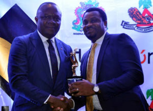R-L: Representative of the MD/CEO of Heritage Bank Plc, Ifie Sekibo is the Regional Executive, Abuja & North, George Oko-Oboh receiving the best "Financial Institution, for Outstanding Support for Tourism” award from the MD/CEO of Transcorp Hotel, Mr. Valentine Ozigbo, during National Tourism Transport Summit and Expo Gala Night Award Dinner held at Transcorp Hotel Abuja.