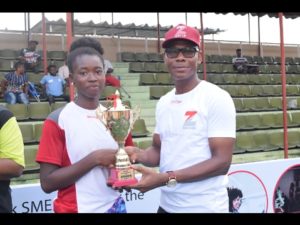 Head, Retail Banking, Zenith Bank Plc, Lanre Oladimeji presenting trophy to the winner of the female category, Omolayo Bamildele at the Zenith Next Gen Tennis competition held at National Stadium.