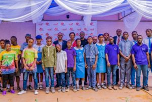Executive Director, United Bank for Africa(UBA) Plc, Mr. Ayoku Liadi; CEO, UBA Foundation, Mrs. Bola Atta; Head, Brand Management, UBA Plc, Mr. Lashe Osoba, flanked by students of various schools during the 2nd edition of UBA Foundation’s ‘Each One, Teach One’ initiative where UBA Staff teach and assist the less privileged, especially students and people living with disabilities across Africa, held in Lagos on Friday.