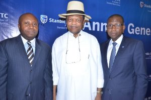 R-L: Company Secretary, Stanbic IBTC Holdings PLC, Mr. Chidi Okezie; Chairman, Mr. Atedo Peterside; and  Chief Executive, Mr. Yinka Sanni; at the 4th  annual general meeting of the company  in Lagos on Tuesday March 7, 2017 