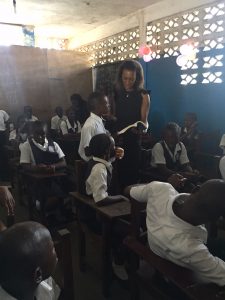 Group Head, Marketing and Corporate Communications, United Bank for Africa, (UBA) Bola Atta, reading to pupils of C. William Brumskine elementary school, Monrovia, during a visit to the school as part of UBA foundations Read Africa, Initiative