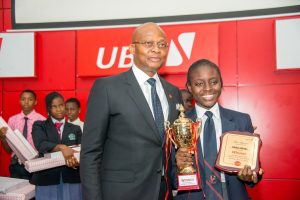 L-R: GMD/CEO, United Bank for Africa (UBA)  Plc, Mr. Kennedy Uzoka with the Overall Winner of the 2017 UBA Foundation National Essay Competition and Student of British Nigerian Academy, Miss Samuella Sam-Orlu during the Grand finale and prize giving ceremony of the  UBA Foundation National Essay Competition  held at UBA House in Lagos on Monday