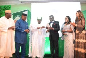 l-r: Chairman and Founder, NOVA Merchant Bank Limited, Mr Phillips Oduoza receiving the Zik Prize for professional leadership from Representative of Ooni of Ife and Aragbeji of Iragbeji land, Oba(Dr) Agboade Makanju, flanked from left by Governor of Ekiti State, Dr. Kayode Fayemi; Member of the Advisory Board of the Public Policy Research and Analysis Centre, PPRAC, organizers of the awards, Sir Mark Wabara; wife of the award recipient, Mrs Jumai Oduoza and wife of the Publisher of Hallmark Newspapers, Dr(Mrs) Betty Obasi, during the award ceremony held in Lagos on Sunday