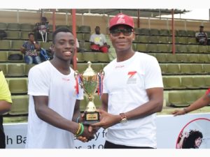 Head, Retail Banking, Zenith Bank Plc, Lanre Oladimeji presenting trophy to the winner of the male category, Musa Mohammed at the Zenith Next Gen Tennis competition held at National Stadium.