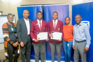 L-R Executive assistant to the Executive Director, Junior Achievers Nigeria, Esther Agbenla; Chief Executive, Stanbic IBTC Trustees Limited, winners of MoneyBee competition, Mr. Charles Omoera; Master Adedeji Fuhad and Master Akerele Smilore, Students of Canterbury International School: Mrs. Seyi Egbarin, Head, Institutional Trust and Loan Agency and Mr. Raji Rahman at the certificate presentation to the winners of the MoneyBee Financial Literacy Competition on Friday, October 25.